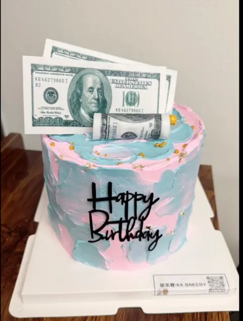 #418 pastel money themed birthday cake with dollar bill toppers and black lettering by KK Bakery in Rosemead