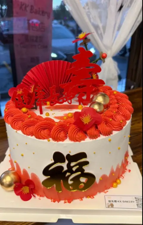 #421 Chinese fortune cake with red dragon, fan, flowers and gold sphere decorations by KK Bakery in Rosemead