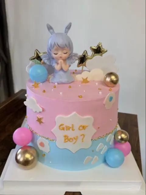 #422 pastel pink and blue gender reveal cake with baby figure, stars and balloons by KK Bakery in Rosemead