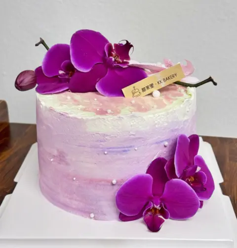 #423 purple watercolor cake with fresh orchid flowers and silver pearl decorations by KK Bakery in Rosemead