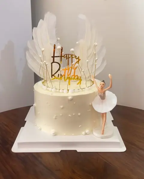 #426 elegant white ballerina birthday cake with feather topper, pearls and gold accents by KK Bakery in Rosemead