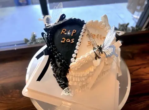 #429 black and cream heart shaped RIP twenties cake with butterfly and vintage piping by KK Bakery in Rosemead