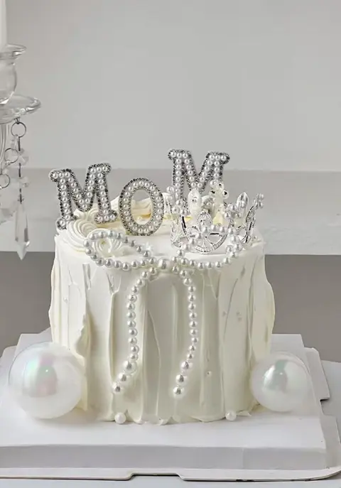 #431 elegant white Mom cake with pearl chains, silver letters and piped ribbon details by KK Bakery in Rosemead