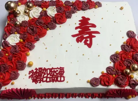 #433 rectangular Chinese longevity cake with red and white roses and gold decorations by KK Bakery in Rosemead