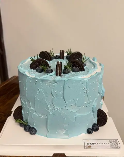 #512 mint blue birthday cake topped with Oreo cookies and chocolate decorations by KK Bakery in Rosemead