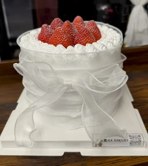 #514 white cake topped with fresh strawberries and decorated with sheer ribbon details by KK Bakery in Rosemead