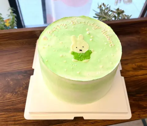 #550 pastel green birthday cake with cute bunny topper and pearl decorations by KK Bakery in Rosemead