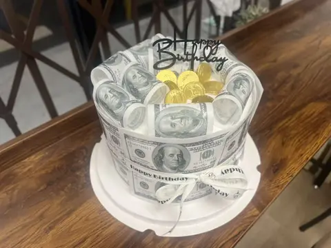 #590 money themed birthday cake wrapped with dollar bill decorations and gold coins by KK Bakery in Rosemead