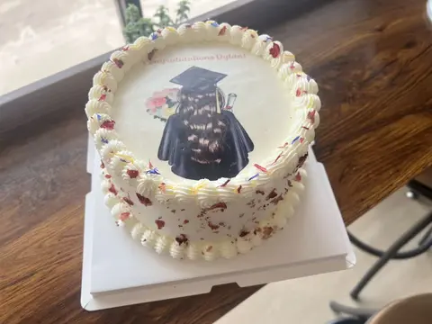 #593 graduation photo cake with piped cream border and colorful sprinkles by KK Bakery in Rosemead