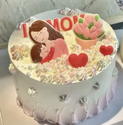 #595 Mother's Day cake with mother and child design, tulips and red hearts by KK Bakery in Rosemead