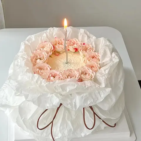 #596 pink ruffle cake with delicate buttercream flowers and ribbon details by KK Bakery in Rosemead