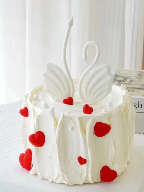 #598 elegant white swan cake with red heart decorations and pearl details by KK Bakery in Rosemead