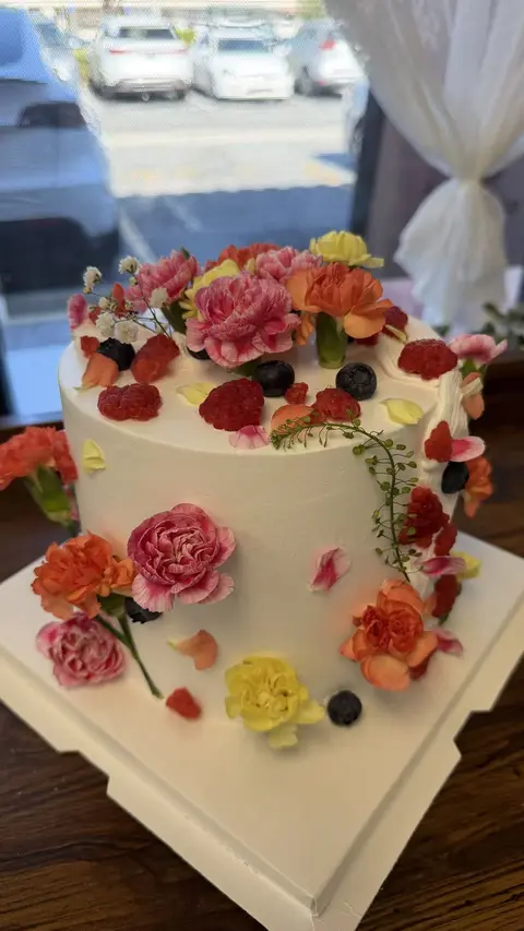 #600 elegant cake with fresh berries and colorful flower decorations by KK Bakery in Rosemead