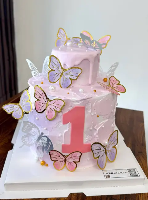#611 pink first birthday cake with gold outlined butterfly decorations by KK Bakery in Rosemead