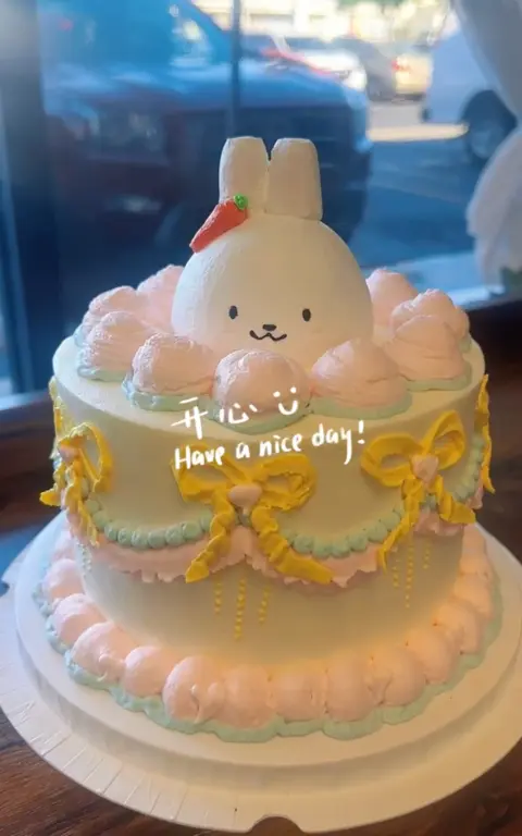 #617 pastel Miffy inspired birthday cake with carrot, bows and pink frosting by KK Bakery in Rosemead