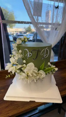 #619 elegant two tier green and white celebration cake with white flowers and silver initials by KK Bakery in Rosemead