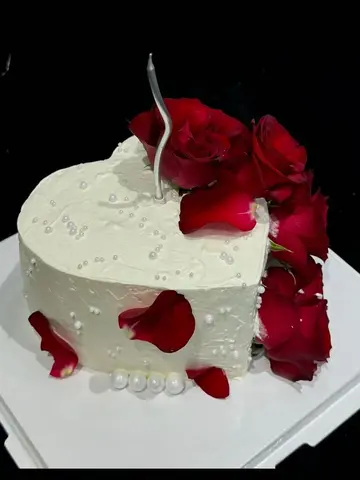 #620 white heart shaped cake with fresh red roses, rose petals and pearl decorations by KK Bakery in Rosemead