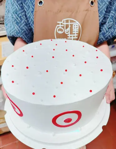 #625 white Target inspired birthday cake with red bullseye designs and pearl decorations by KK Bakery in Rosemead