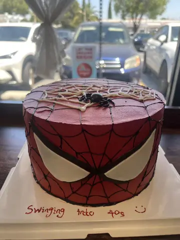 #627 red Spider-Man inspired birthday cake with web design, mask face and spider decoration by KK Bakery in Rosemead