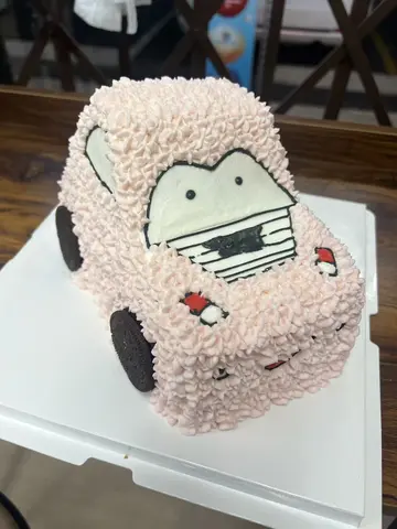#629 cute pink car shaped birthday cake with character driver and small decorative details by KK Bakery in Rosemead